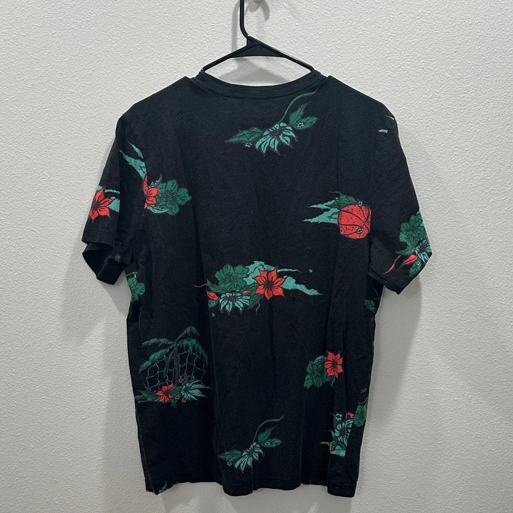 The Nike Tee men’s all over print black floral large floral basketball